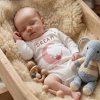 Baby wearing the DREAM bodysuit in white (0–6 months) with hand-drawn illustration by Justmimmi