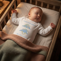 Baby wearing the sweet little dreams in white (0–6 months) with hand-drawn illustration by Justmimmi