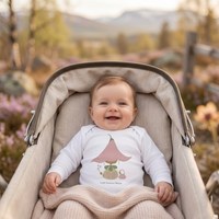 Baby wearing the twinflower bodysuit in white (0–6 months) with hand-drawn illustration by Justmimmi